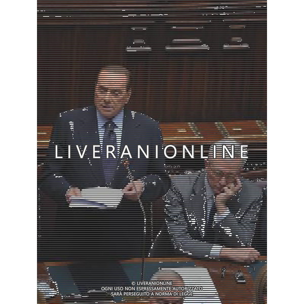 (110803) -- ROME, Aug. 3, 2011 () -- Italian Prime Minister Silvio Berlusconi (L), flanked by Minister of Economy and Finance Giulio Tremonti, speaks at the parliament in Rome, Italy, Aug. 3, 2011. Berlusconi addressed the parliament Wednesday on the country\'s economic situation, in an effort to soothe growing concerns over Italy\'s economy. (/Wang Qingqin)