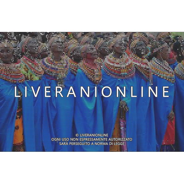 (110803) -- NAIROBI, Aug. 3, 2011 () -- Samburu women sing a song in Isiolo in the north of Kenya, July 29, 2011. The Samburu tribe lives in the north of Kenya. The word \'Samburu\' means \'butterfly\' in the language of Masai as their traditional clothes are striking with colorful beaded necklaces, earrings and bracelets. (/Zhao Yingquan) (zw)