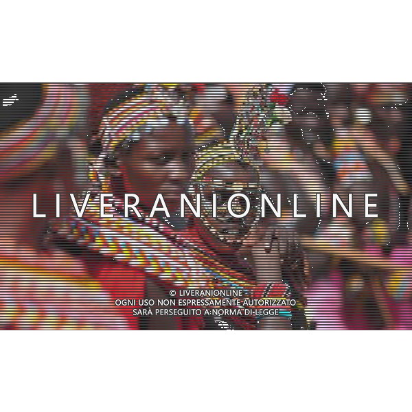 (110803) -- NAIROBI, Aug. 3, 2011 () -- A Samburu girl is seen in Isiolo in the north of Kenya, July 29, 2011. The Samburu tribe lives in the north of Kenya. The word \'Samburu\' means \'butterfly\' in the language of Masai as their traditional clothes are striking with colorful beaded necklaces, earrings and bracelets. (/Zhao Yingquan) (zw)