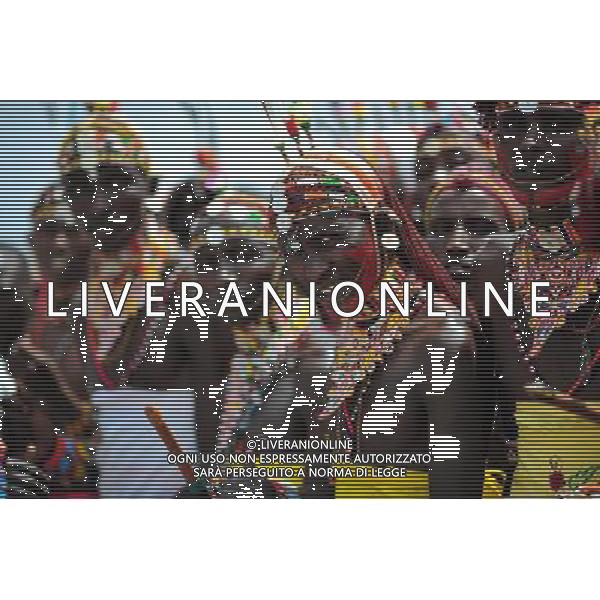 (110803) -- NAIROBI, Aug. 3, 2011 () -- Samburu warriors are seen in Isiolo in the north of Kenya, July 29, 2011. The Samburu tribe lives in the north of Kenya. The word \'Samburu\' means \'butterfly\' in the language of Masai as their traditional clothes are striking with colorful beaded necklaces, earrings and bracelets. (/Zhao Yingquan) (zw)
