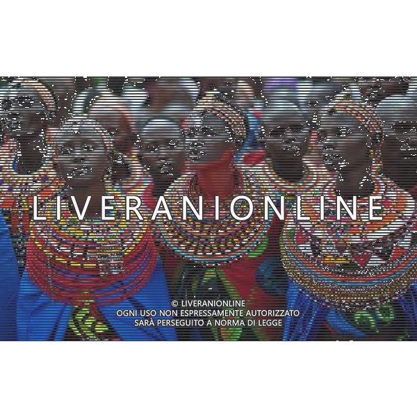 (110803) -- NAIROBI, Aug. 3, 2011 () -- Samburu women sing a song in Isiolo in the north of Kenya, July 29, 2011. The Samburu tribe lives in the north of Kenya. The word \'Samburu\' means \'butterfly\' in the language of Masai as their traditional clothes are striking with colorful beaded necklaces, earrings and bracelets. (/Zhao Yingquan) (zw)