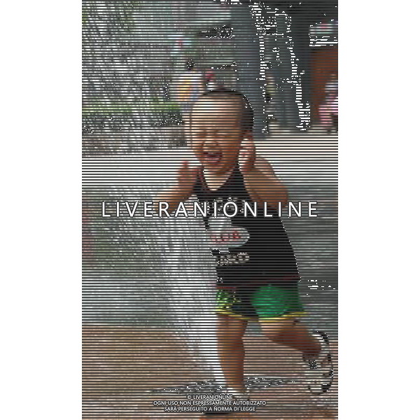 (110805) SHENYANG, Aug. 5, 2011 A little boy cools off at a fountain in Shenyang, capital of northeast China\'s Liaoning Province, Aug. 5, 2011. The city is experiencing a hot summer, with the highest temperature reaching 31 degrees Centigrade on Friday. (/Yang Qing) (ry)