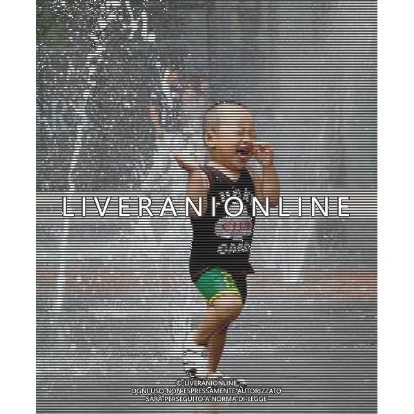 (110805) SHENYANG, Aug. 5, 2011 A little boy cools off at a fountain in Shenyang, capital of northeast China\'s Liaoning Province, Aug. 5, 2011. The city is experiencing a hot summer, with the highest temperature reaching 31 degrees Centigrade on Friday. (/Yang Qing) (ry)