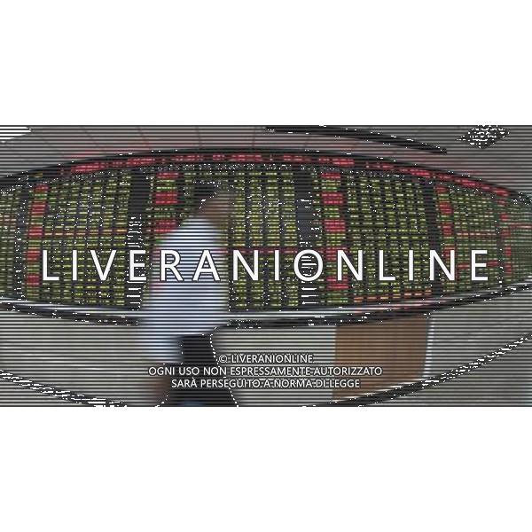 (110808) -- SHANGHAI, Aug. 8, 2011 () -- An investor passes by an electronic board displaying stock prices at a brokerage house in Shanghai, east China, Aug. 8, 2011. The benchmark Shanghai Composite Index slumped 3.79 percent to close at 2,526.82 points while the Shenzhen Component Index dropped 3.33 percent to finish at 11,312.63 points. (/Zhu Quanchun) (hdt)