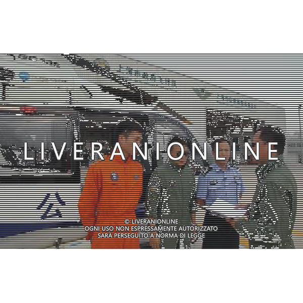 (110808) -- SHANGHAI, Aug. 8, 2011 () -- Captain Lu Lingwei (1st R) assigns missions to the crew members of the Shanghai Police Aviation Force in Shanghai, east China, Aug. 8, 2011. Shanghai police have launched a daily air inspection on the traffic condition of three major highways. The inspection would be conducted by helicopters for four hours a day over the highways that respectively link Beijing and Shanghai, Shanghai and Kunming, as well as Shenyang and Haikou. The move aims at detecting congestion and providing real-time traffic information to citizens, as well as capturing traffic-violating behaviors as early as possibly. (/Fan Jun) (llp)