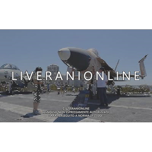 (110809) SAN DIEGO, Aug. 9, 2011 () Visitors watch F/A 18 Hornet on USS Midway in San Diego, California on Aug. 7, 2011. USS Midway (CVB/CVA/CV 41) was an aircraft carrier of the United States Navy, the lead ship of her class, and the first to be commissioned after the end of World War II. Active in the Vietnam War and in Operation Desert Storm, she is currently a museum ship at the San Diego Aircraft Carrier Museum, in San Diego, California. (/Yang Lei) (wf)