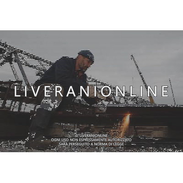 (110809) -- MOSCOW, Aug. 9, 2011 () -- A worker works on the extended line project of the Trans Siberian Railway (TSR) from Vladivostok to the airport, Russia, on Aug. 3, 2011. The 9,288-kilometer Trans-Siberian railway, which connects Vladivostok with Moscow, is the world\'s longest single railway system. The railway system, bringing Russia huge economic benefit, serves as the main channel of the countries\' transportation on land, carrying goods from ports of far east regions to central areas of European part of Russia. In recent years, Russia increased the investment in the transformation of the railway system and newly-built projects to improve the proficiency of the railway. It is the 120th anniversary of the construction of TSR this year, and Russia decided to invest 193 billion ruble (about 6.5 billion USD) in the eastern section of TSR to improve the freight transport from ports of the far east regions. (/Jiang Kehong) (lr)