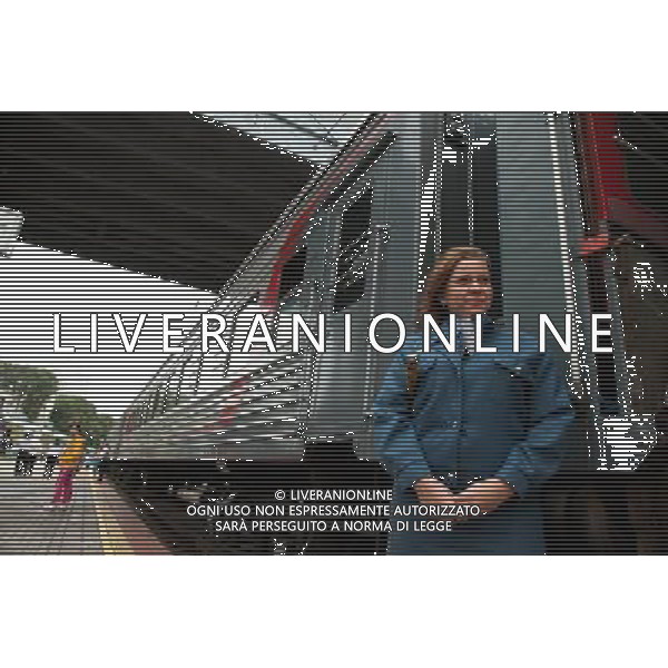 (110809) -- MOSCOW, Aug. 9, 2011 () -- A stewardess waits for passengers to get on a train at Vladivostok stop of the Trans Siberian Railway (TSR), Russia, on Aug. 1, 2011. The 9,288-kilometer Trans-Siberian railway, which connects Vladivostok with Moscow, is the world\'s longest single railway system. The railway system, bringing Russia huge economic benefit, serves as the main channel of the countries\' transportation on land, carrying goods from ports of far east regions to central areas of European part of Russia. In recent years, Russia increased the investment in the transformation of the railway system and newly-built projects to improve the proficiency of the railway. It is the 120th anniversary of the construction of TSR this year, and Russia decided to invest 193 billion ruble (about 6.5 billion USD) in the eastern section of TSR to improve the freight transport from ports of the far east regions. (/Jiang Kehong) (lr)