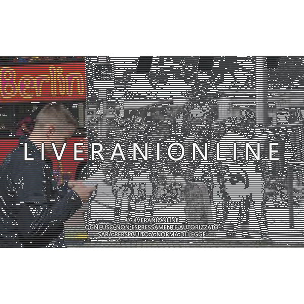 (110810) -- BERLIN, August 10, 2011 () -- A man pass by a huge historic picture about the former Berlin Wall at Potsdamer Platz in Berlin, capital of Germany on August 8, 2011. Berlin is marking the 50th anniversary of the Berlin Wall, which started building on August 13, 1961. (/Ma Ning)