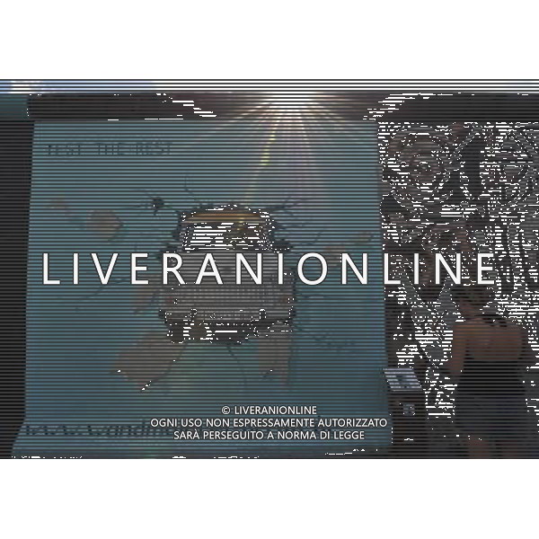 (110810) -- BERLIN, August 10, 2011 () -- Tourist watches a graffito on East Side Gallery, the largest remaining part of the former Berlin Wall in Berlin, capital of Germany on August 6, 2011. Berlin is marking the 50th anniversary of the Berlin Wall, which started building on August 13, 1961. (/Ma Ning)