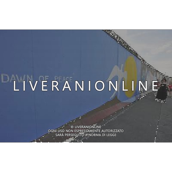 (110810) -- BERLIN, August 10, 2011 () -- Tourists walk along East Side Gallery, the largest remaining part of the former Berlin Wall in Berlin, capital of Germany on August 6, 2011. Berlin is marking the 50th anniversary of the Berlin Wall, which started building on August 13, 1961. (/Ma Ning)