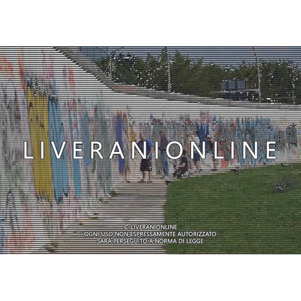 (110810) -- BERLIN, August 10, 2011 () -- Young men paint graffiti at East Side Gallery, the largest remaining part of the former Berlin Wall in Berlin, capital of Germany on August 6, 2011. Berlin is marking the 50th anniversary of the Berlin Wall, which started building on August 13, 1961. (/Ma Ning)