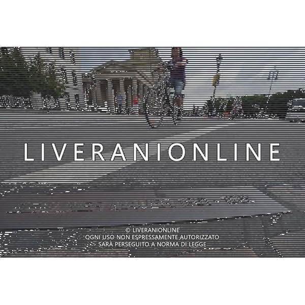 (110810) -- BERLIN, August 10, 2011 () -- Cyclist pass a plaque noting the track of former Berlin Wall in front of Brandenburger Gate, central of Berlin, capital of Germany on August 1, 2011. Berlin is marking the 50th anniversary of the Berlin Wall, which started building on August 13, 1961. (/Ma Ning)