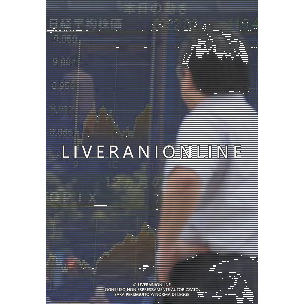 (110811) -- TOKYO, Aug. 11, 2011 () -- A man views an electrical board showing the stock information in Tokyo, Aug. 11, 2011. Tokyo stocks fell Thursday morning with the key Nikkei index plunging 1.29 percent. At 11 a.m., the benchmark Nikkei 225 Average lost 116.42 points from Wednesday to 8922.32. The broader Topix index contracted 9.76 points, or 1.26 percent, to 766.97.(/Kenichiro Seki) (xhn)