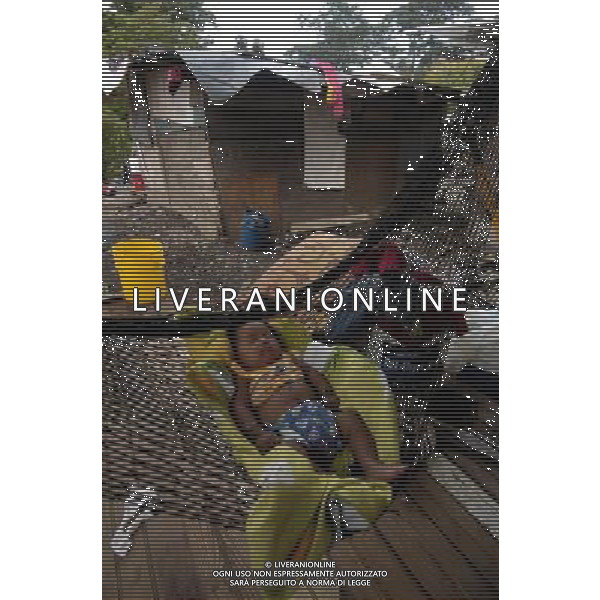(110811) -- PANAMA CITY, Aug. 11, 2011 () -- Gabriel,one year old resident of the settlement marginal Kuna Nega, takes a nap in her home made with waste materials from the National Landfill located on the outskirts of Panama City, capital of Panama, Aug. 10, 2011. Residents in Kuna Nega, a squatter settlement, lack basic services and use garbage as a means of survival. (/Mauricio Valenzuela) (py)