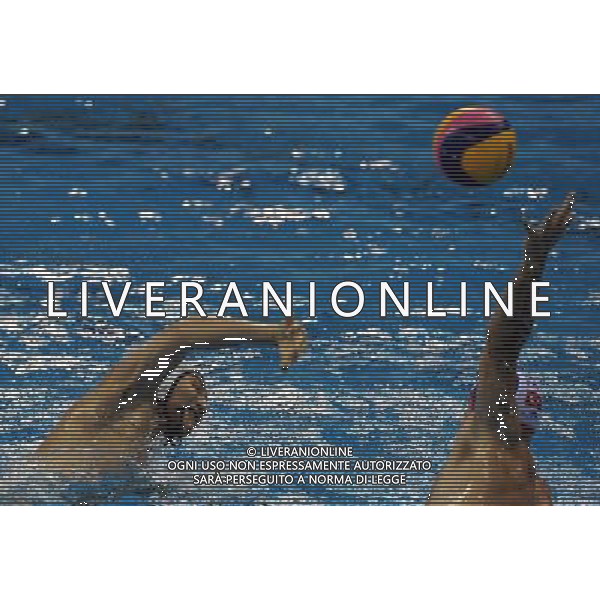 (110811) SHENZHEN, Aug. 11, 2011 Zhang Junlong (L) of China shoots during the group A preliminary match of men\'s waterpolo against Turkey at the 26th Summer Universiade in Shenzhen, a city of south China\'s Guangdong Province, Aug. 11, 2011. China won 14 7. (/Lin Yiguang)(lm)