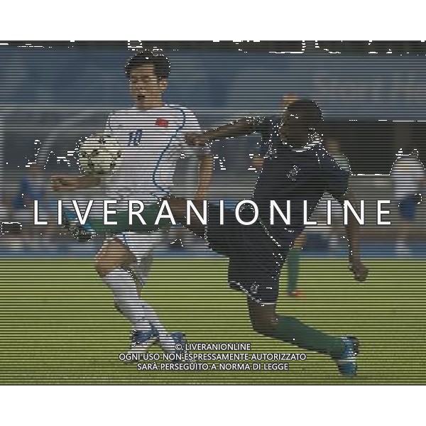 (110811) SHENZHEN, Aug. 11, 2011 Yang Yang (L) of China vies with Raymordt Romuni Mate of Namibia during their group A preliminary match of men\'s football at the 26th Summer Universiade in Shenzhen, a city of south China\'s Guangdong Province, Aug. 11, 2011. The match ended with a 1 1 draw. (/Lui Siu Wai)(lm)
