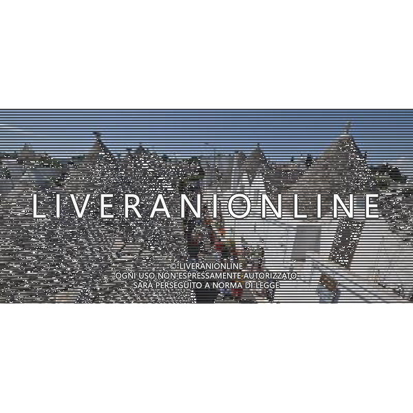 (110812) ALBEROBELLO, Aug. 12, 2011 Photo taken on Aug. 10, 2011 shows the Trulli in Alberobello, southern Italy. Alberobello, the city of drystone dwellings known as trulli, is an exceptional example of vernacular architecture. The trulli are made of roughly worked limestone boulders collected from neighbouring fields. Characteristically, they feature pyramidal, domed or conical roofs built up of corbelled limestone slabs. UNESCO inscribed the Trulli of Alberobello in the World Heritage List in 1996. (/Wang Qingqin)