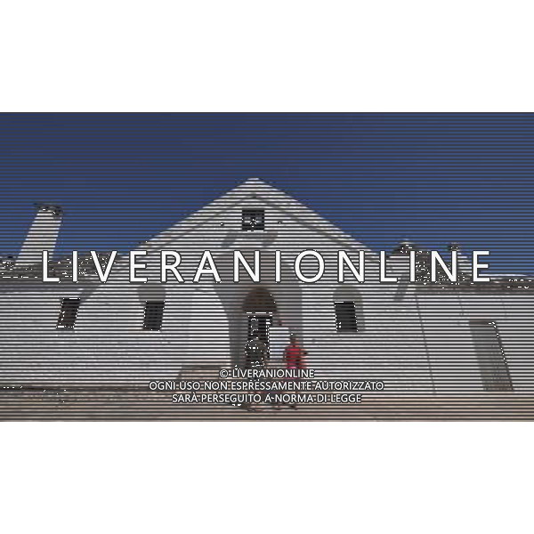 (110812) ALBEROBELLO, Aug. 12, 2011 Photo taken on Aug. 10, 2011 shows the only two floored Trulli in Alberobello, southern Italy. Alberobello, the city of drystone dwellings known as trulli, is an exceptional example of vernacular architecture. The trulli are made of roughly worked limestone boulders collected from neighbouring fields. Characteristically, they feature pyramidal, domed or conical roofs built up of corbelled limestone slabs. UNESCO inscribed the Trulli of Alberobello in the World Heritage List in 1996. (/Wang Qingqin)