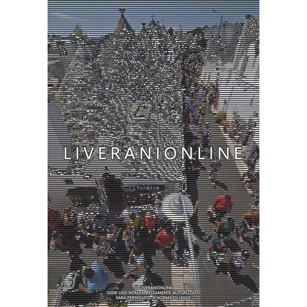 (110812) ALBEROBELLO, Aug. 12, 2011 Tourists visit the Trulli in Alberobello, southern Italy, Aug. 10, 2011. Alberobello, the city of drystone dwellings known as trulli, is an exceptional example of vernacular architecture. The trulli are made of roughly worked limestone boulders collected from neighbouring fields. Characteristically, they feature pyramidal, domed or conical roofs built up of corbelled limestone slabs. UNESCO inscribed the Trulli of Alberobello in the World Heritage List in 1996. (/Wang Qingqin) AG ALDO LIVERANI S A S ONLY ITALY