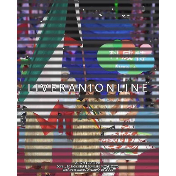 (110812)SHENZHEN, Aug. 12, 2011 Members of Kuwait\'s delegation enter the site during the opening ceremony of the 26th Summer Universiade in Shenzhen, a city of south China\'s Guangdong Province, on Aug. 12, 2011. (/Guo Yong)(kh)