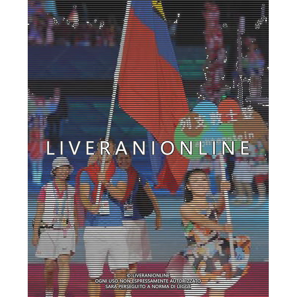 (110812)SHENZHEN, Aug. 12, 2011 Members of Liechtenstein\'s delegation enter the site during the opening ceremony of the 26th Summer Universiade in Shenzhen, a city of south China\'s Guangdong Province, on Aug. 12, 2011. (/Guo Yong)(kh)