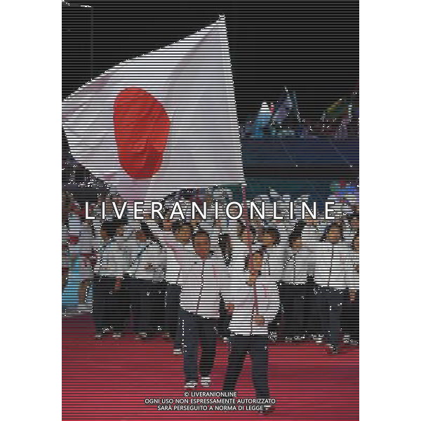 (110812)SHENZHEN, Aug. 12, 2011 Members of Japan\'s delegation enter the site during the opening ceremony of the 26th Summer Universiade in Shenzhen, a city of south China\'s Guangdong Province, on Aug. 12, 2011. (/Yang Shiyao)(kh)