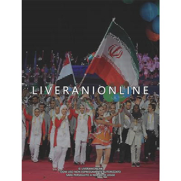 (110812)SHENZHEN, Aug. 12, 2011 Members of the Islamic Republic of Iran\'s delegation enter the site during the opening ceremony of the 26th Summer Universiade in Shenzhen, a city of south China\'s Guangdong Province, on Aug. 12, 2011. (/Yang Shiyao)(kh)