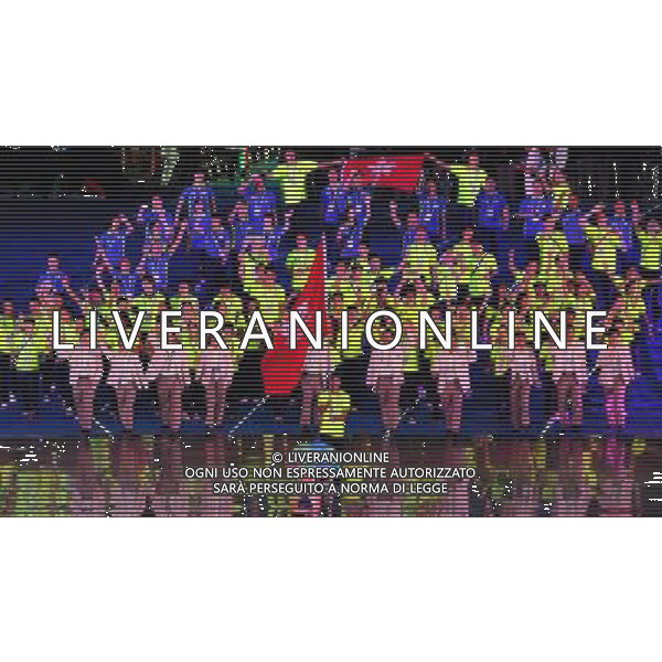 (110812)SHENZHEN, Aug. 12, 2011 Members of Chinese Hong Kong\'s delegation enter the site during the opening ceremony of the 26th Summer Universiade in Shenzhen, a city of south China\'s Guangdong Province, on Aug. 12, 2011. (/Wang Song)(kh)