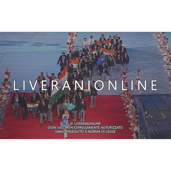 (110812)SHENZHEN, Aug. 12, 2011 Members of India\'s delegation enter the site during the opening ceremony of the 26th Summer Universiade in Shenzhen, a city of south China\'s Guangdong Province, on Aug. 12, 2011. (/Chen Jianli)(kh)
