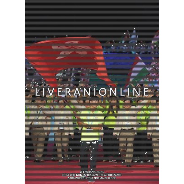(110812)SHENZHEN, Aug. 12, 2011 Members of Chinese Hong Kong\'s delegation enter the site during the opening ceremony of the 26th Summer Universiade in Shenzhen, a city of south China\'s Guangdong Province, on Aug. 12, 2011. (/Yang Shiyao)(kh)