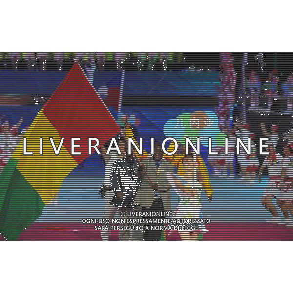 (110812)SHENZHEN, Aug. 12, 2011 Members of Guinea\'s delegation enter the site during the opening ceremony of the 26th Summer Universiade in Shenzhen, a city of south China\'s Guangdong Province, on Aug. 12, 2011. (/Guo Yong)(kh)