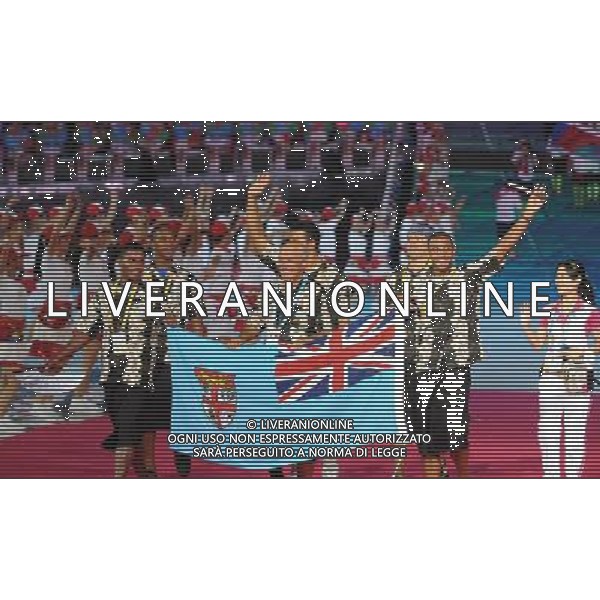 (110812)SHENZHEN, Aug. 12, 2011 Members of Fiji\'s delegation enter the site during the opening ceremony of the 26th Summer Universiade in Shenzhen, a city of south China\'s Guangdong Province, on Aug. 12, 2011. (/Yang Shiyao)(kh)