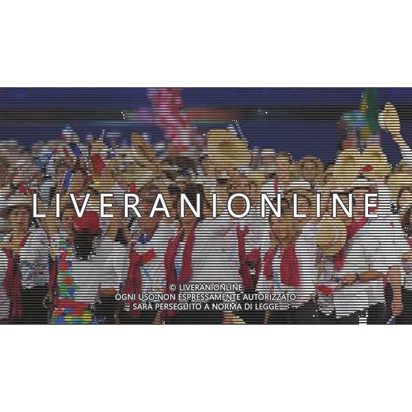 (110812)SHENZHEN, Aug. 12, 2011 Members of France\'s delegation enter the site during the opening ceremony of the 26th Summer Universiade in Shenzhen, a city of south China\'s Guangdong Province, on Aug. 12, 2011. (/Guo Yong)(kh)