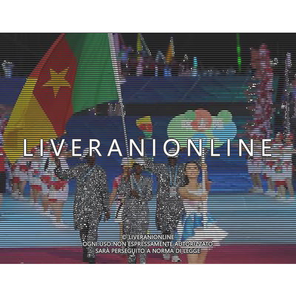 (110812)SHENZHEN, Aug. 12, 2011 Members of Cameroon\'s delegation enter the site during the opening ceremony of the 26th Summer Universiade in Shenzhen, a city of south China\'s Guangdong Province, on Aug. 12, 2011. (/Guo Yong)(kh)