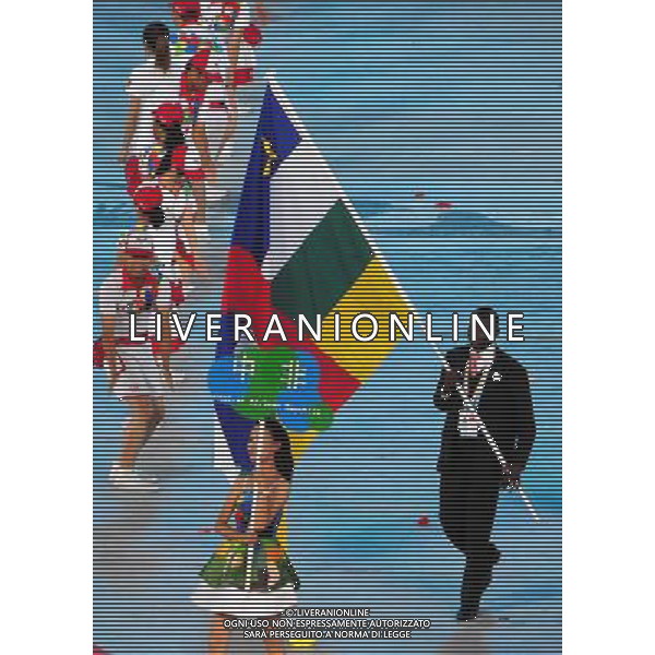 (110812)SHENZHEN, Aug. 12, 2011 Members of Central African Republic\'s delegation enter the site during the opening ceremony of the 26th Summer Universiade in Shenzhen, a city of south China\'s Guangdong Province, on Aug. 12, 2011. (/Wang Song)(kh)