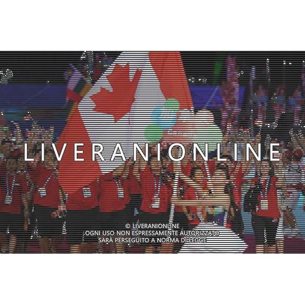(110812)SHENZHEN, Aug. 12, 2011 Members of Canada\'s delegation enter the site during the opening ceremony of the 26th Summer Universiade in Shenzhen, a city of south China\'s Guangdong Province, on Aug. 12, 2011. (/Guo Yong)(kh)