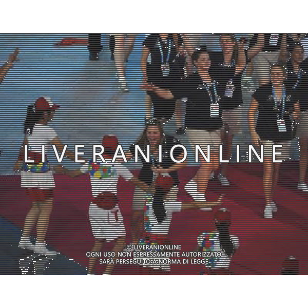 (110812)SHENZHEN, Aug. 12, 2011 Members of Australia\'s delegation enter the site during the opening ceremony of the 26th Summer Universiade in Shenzhen, a city of south China\'s Guangdong Province, on Aug. 12, 2011. (/Lui Siu Wai)(kh)