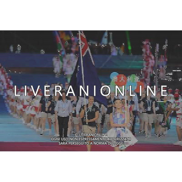 (110812)SHENZHEN, Aug. 12, 2011 Members of Australia\'s delegation enter the site during the opening ceremony of the 26th Summer Universiade in Shenzhen, a city of south China\'s Guangdong Province, on Aug. 12, 2011. (/Guo Yong)(kh)