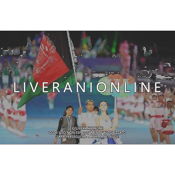 (110812)SHENZHEN, Aug. 12, 2011 Members of Afghanistan\'s delegation enter the site during the opening ceremony of the 26th Summer Universiade in Shenzhen, a city of south China\'s Guangdong Province, on Aug. 12, 2011. (/Guo Yong)(wx)