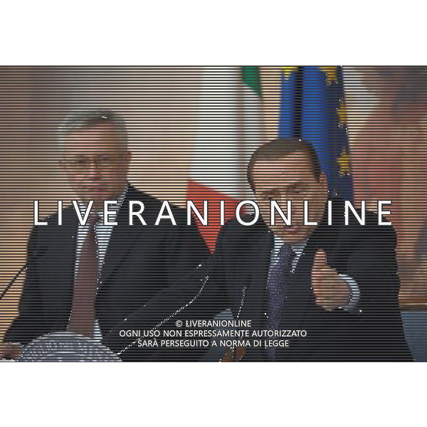 (110812) -- ROME, Aug. 12, 2011 () -- Italian Prime Minister Silvio Berlusconi (R) and Minister of Economy and Finance Giulio Tremonti attend a press conference after a cabinet meeting on financial situation in Rome, Italy, Aug. 12, 2011. The Italian cabinet approved a 45.5 billion euro (about 64.8 billion U.S. dollars) austerity program Friday evening for the upcoming two years in a bid to meet budgetary requirements by the European Central Bank (ECB) and reassure markets. (/Wang Qingqin)