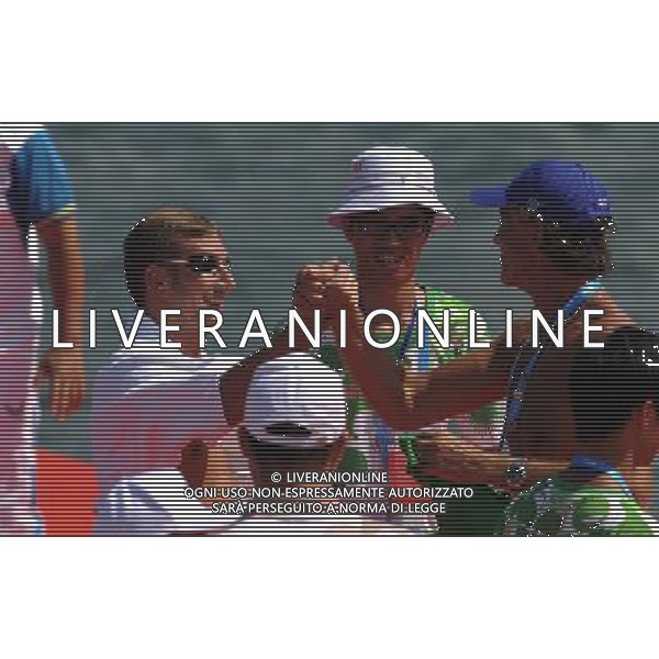 (110813) -- SHENZHEN, Aug. 13, 2011 () -- Simone Ruffini)(L) of Italy receives congratulations after winning the men\'s open water 10km swimming at the 26th Summer Universiade in Shenzhen, a city of south China\'s Guangdong Province, Aug. 13, 2011. Simone Ruffini claimed the title of the event to win the first gold medal of the 26th Summer Universiade. (/Lu Hanxin)(kh)