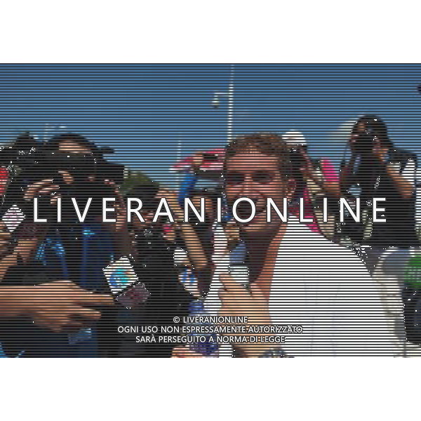 (110813) -- SHENZHEN, Aug. 13, 2011 () -- Simone Ruffini of Italy receives interview after winning the men\'s open water 10km swimming at the 26th Summer Universiade in Shenzhen, a city of south China\'s Guangdong Province, Aug. 13, 2011. Simone Ruffini claimed the title of the event to win the first gold medal of the 26th Summer Universiade. (/Lu Hanxin)(kh)