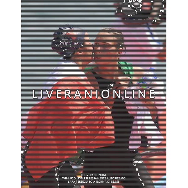 (110813) -- SHENZHEN, Aug. 13, 2011 () -- Rachele Bruni (R) of Italy receives congratulations from her teammate Alice Franco after winning the women\'s open water 10km swimming at the 26th Summer Universiade in Shenzhen, a city of south China\'s Guangdong Province, Aug. 13, 2011. Rachele Bruni claimed the title of the event with 2 hours 6 minutes and 49.31 seconds. (/Lu Hanxin)(kh)