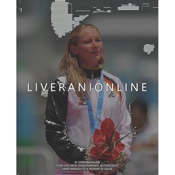 (110813) -- SHENZHEN, Aug. 13, 2011 () -- Nadine Reichert of Geramny reacts during the awarding ceremony for women\'s open water 10km swimming at the 26th Summer Universiade in Shenzhen, a city of south China\'s Guangdong Province, Aug. 13, 2011. Nadine Reichert won the silver medal of the event with 2 hours 7 minutes and 29.21 seconds. (/Lu Hanxin)(kh)