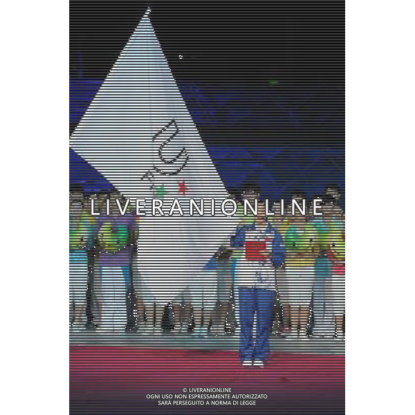 (110812) -- SHENZHEN, Aug. 12, 2011 () -- Chinese student Gong Yuan (front), representative of athletes, takes an oath during the opening ceremony of the 26th Summer Universiade in Shenzhen, a city of south China\'s Guangdong Province, on Aug. 12, 2011. (/Yang Shiyao)(kh)