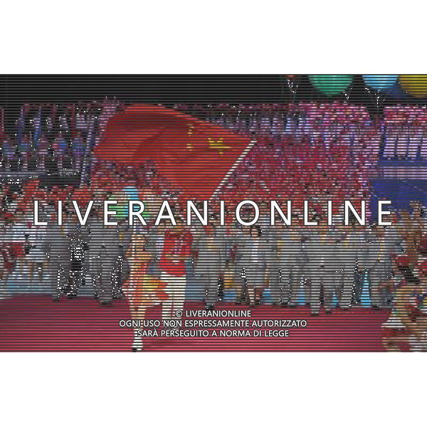 (110812) -- SHENZHEN, Aug. 12, 2011 () -- Members of China\'s delegation enter the site during the opening ceremony of the 26th Summer Universiade in Shenzhen, a city of south China\'s Guangdong Province, on Aug. 12, 2011. (/Yang Shiyao)(kh)