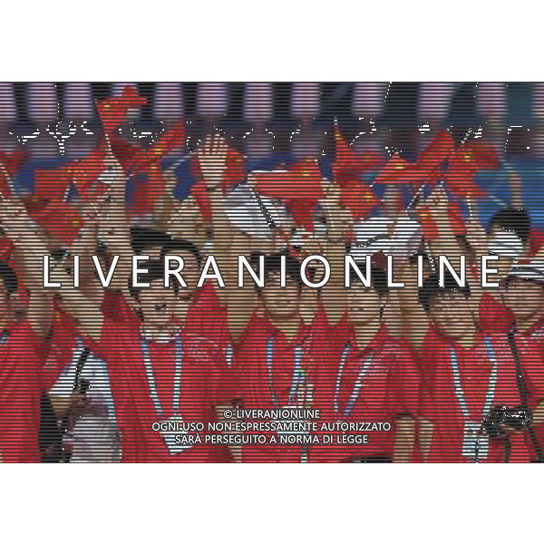 (110812) -- SHENZHEN, Aug. 12, 2011 () -- Members of China\'s delegation enter the site during the opening ceremony of the 26th Summer Universiade in Shenzhen, a city of south China\'s Guangdong Province, on Aug. 12, 2011. (/Guo Yong)(kh)