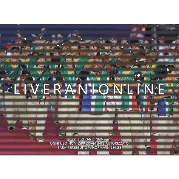 (110812) -- SHENZHEN, Aug. 12, 2011 () -- Members of South Africa\'s delegation enter the site during the opening ceremony of the 26th Summer Universiade in Shenzhen, a city of south China\'s Guangdong Province, on Aug. 12, 2011. (/Guo Yong)(kh)