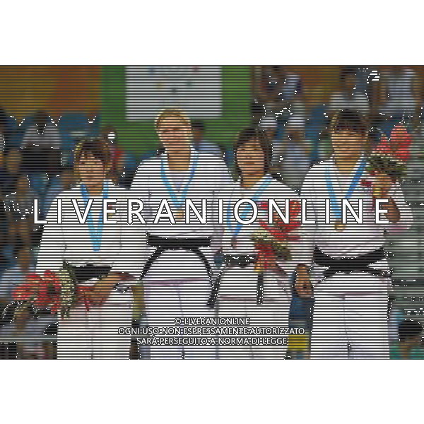 (110814) -- SHENZHEN, Aug. 14, 2011 () -- Gold medalist Esther Stam of the Netherlands (2nd L), Silver medalist Tanaka Miki of Japan (1st L), bronze medalists Hwang Chun Gum of the Democratic People\'s Republic of Korea (2nd R) and Lin Meiling of China pose on the podium during the awarding ceremony of women\'s Judo 63KG at the 26th Summer Universiade in Shenzhen, a city of south China\'s Guangdong Province, Aug. 14, 2011. (/Liu Dawei)
